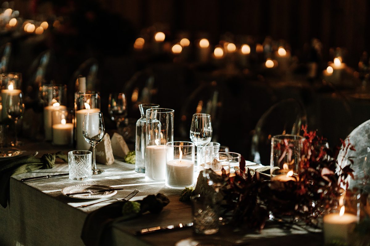 Moody candlelit reception table