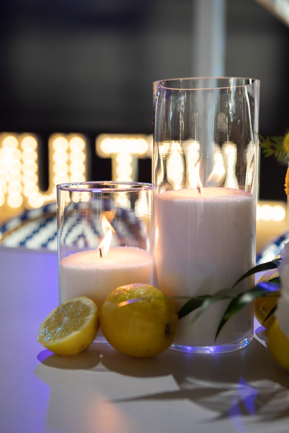 White sand wax candles in glass, close up